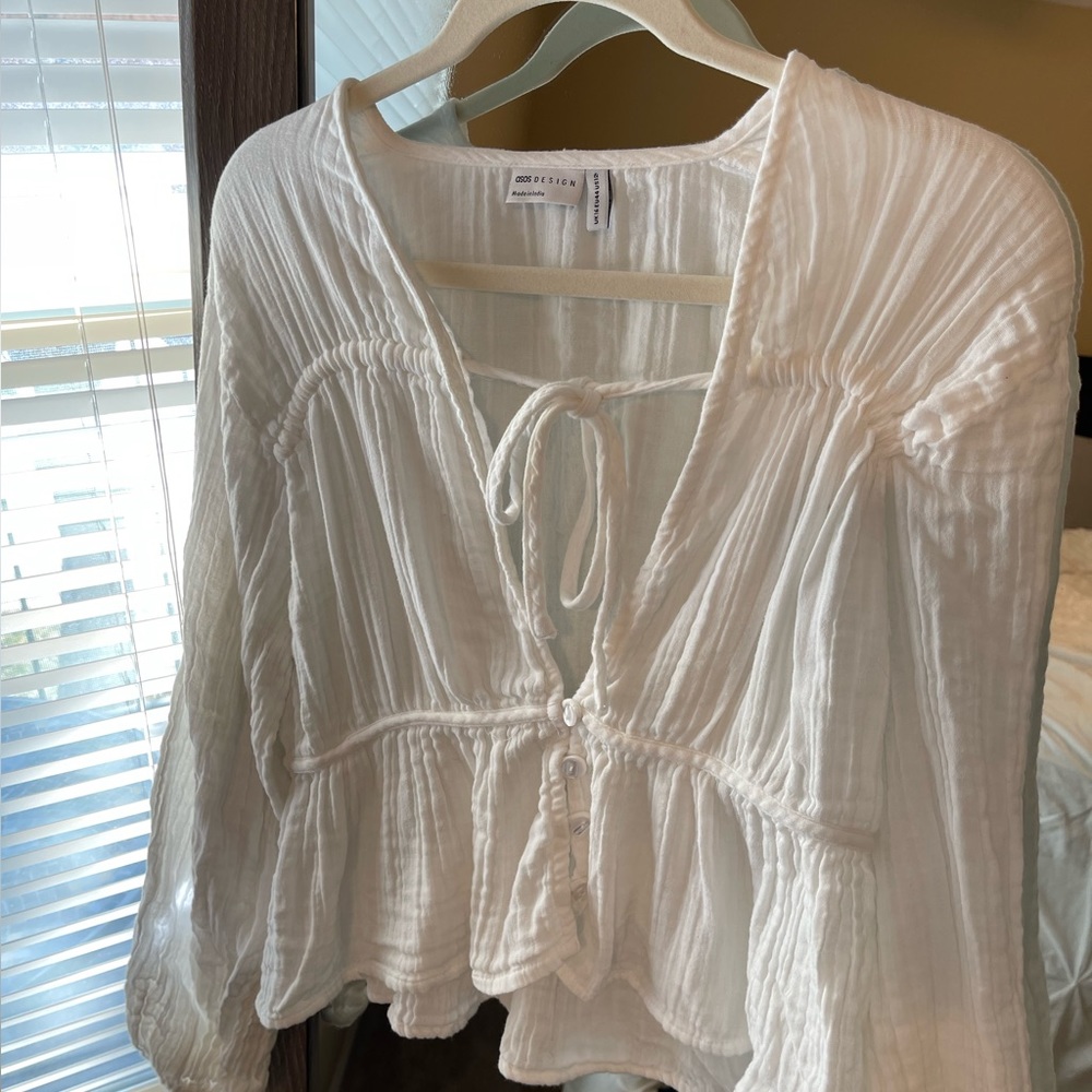 ASOS natural crinkle long sleeve button blouse with the front detail in white.